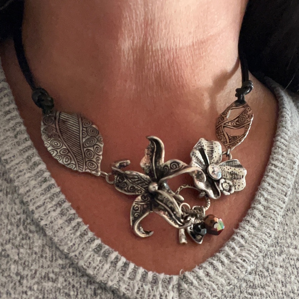 Pretty metal necklace with leather chain
